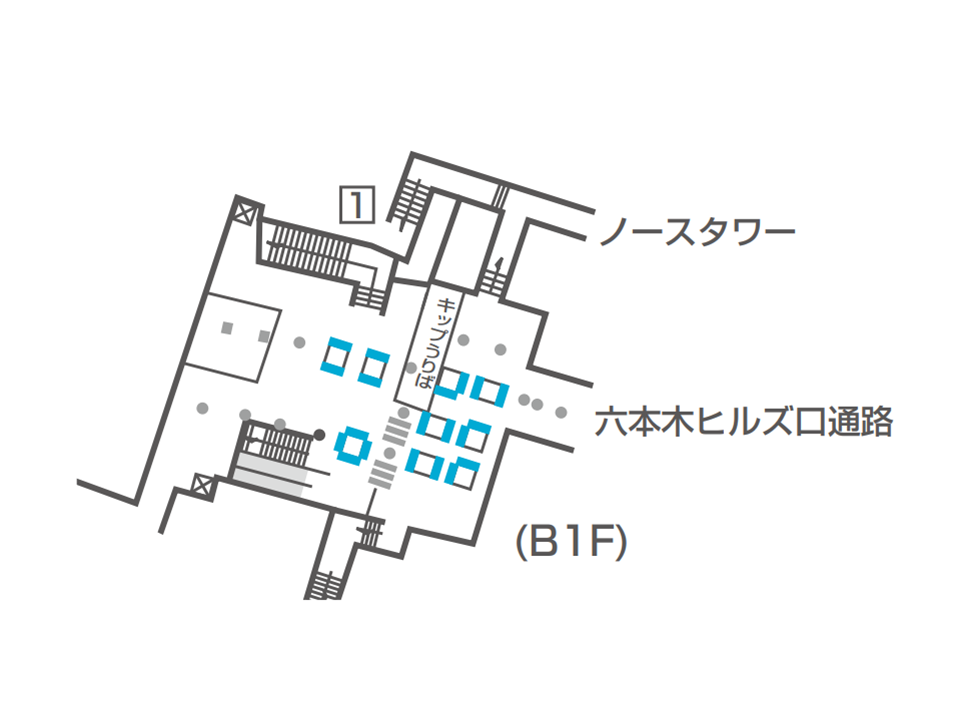 六本木駅のどこにデジタルサイネージが設置されているか説明している画像です。西麻布方面改札のそば